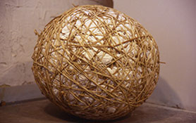 large paper ball wrapped with elastic bands